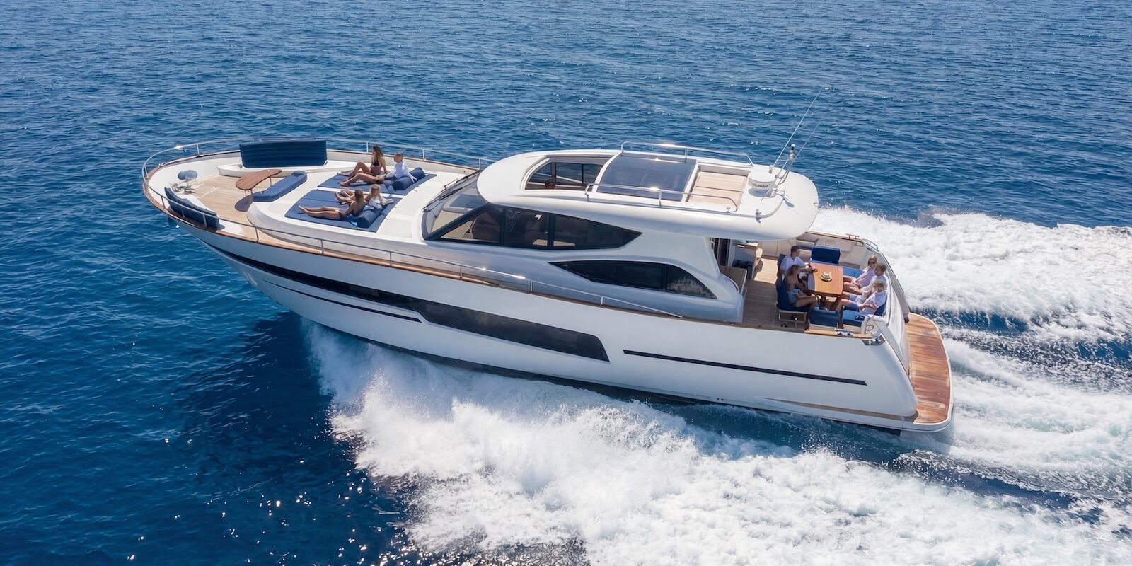 Why Yacht Buyers Are Looking Beyond the Big Names Luxury motor yacht cruising across calm blue sea