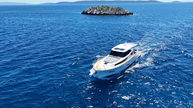 Luxury motor yacht cruising off a Croatian island