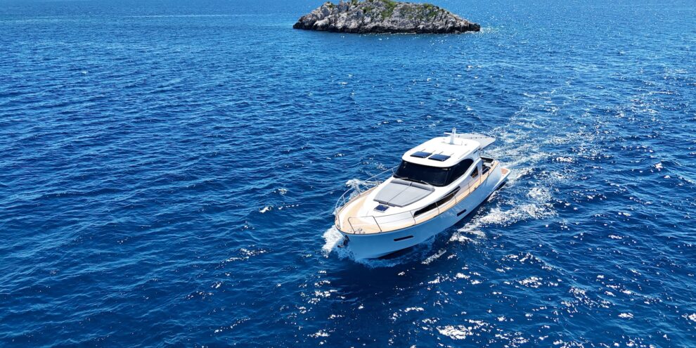 Luxury motor yacht cruising off a Croatian island