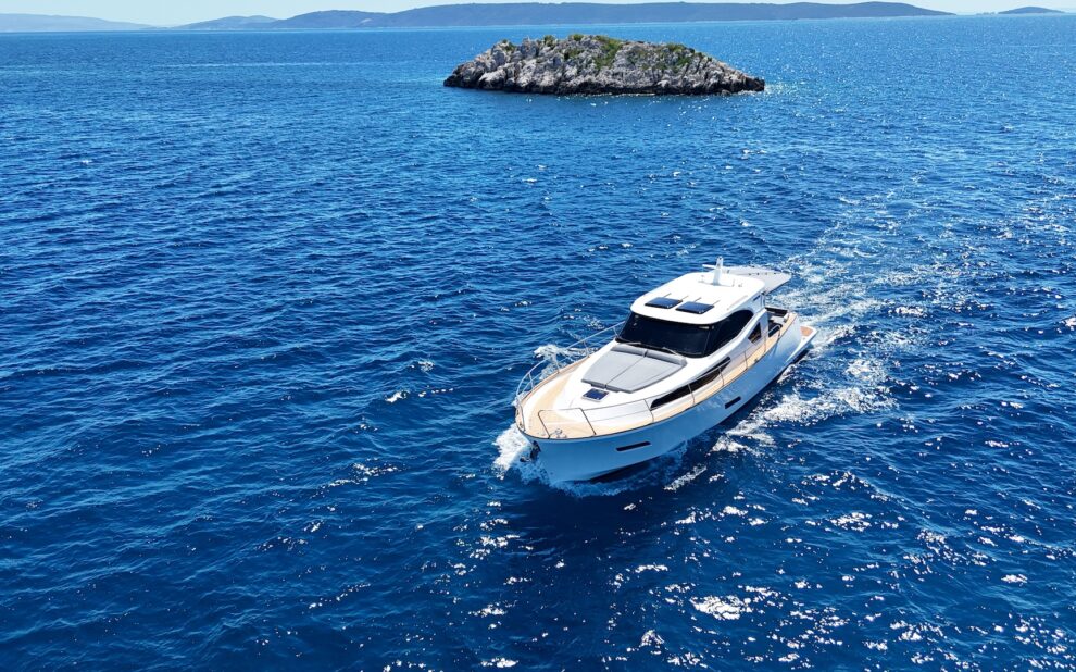 Luxury motor yacht cruising off a Croatian island