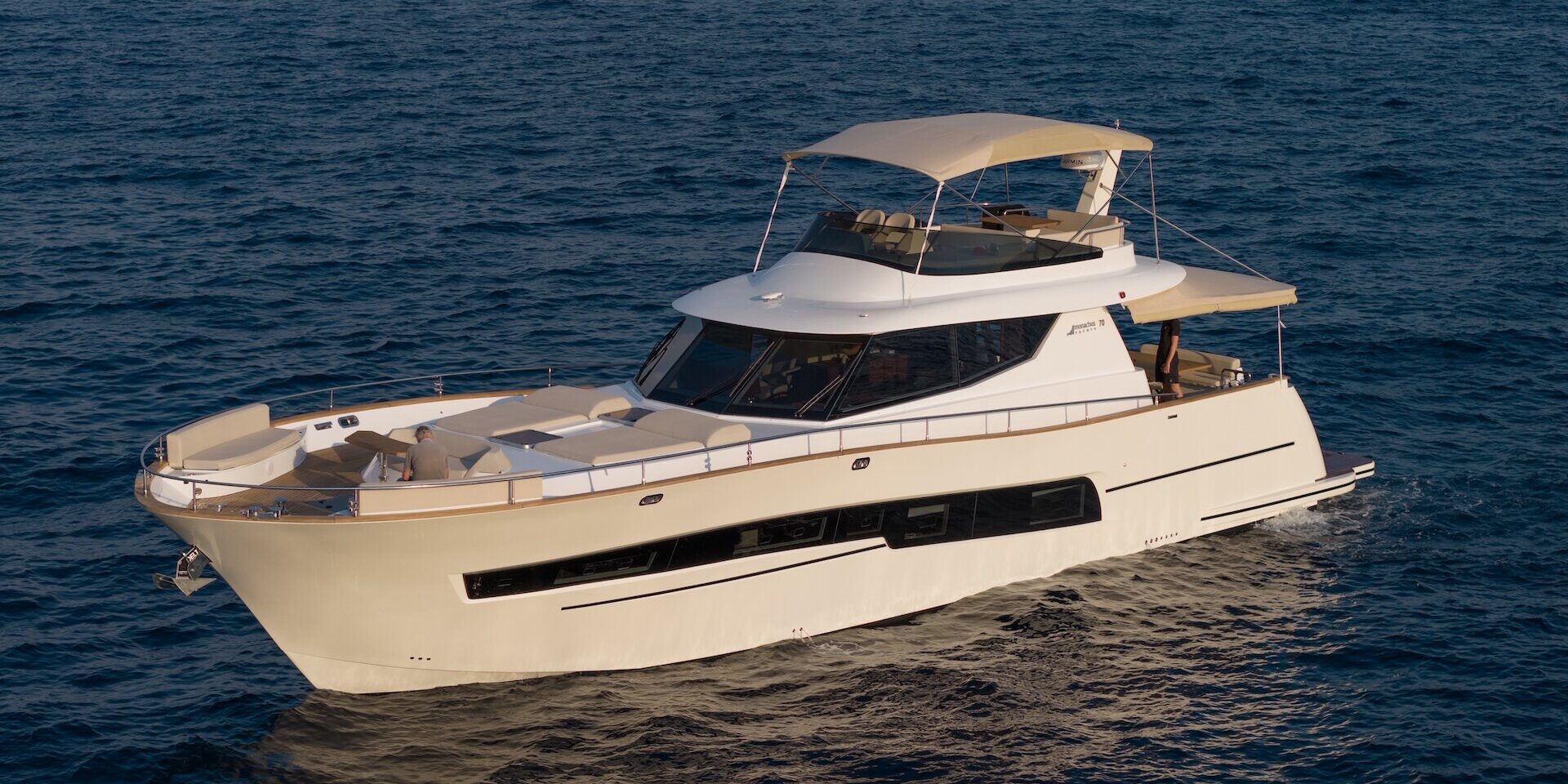 Monachus MY70F: A Yacht Made for Life at Sea White flybridge yacht on calm open water