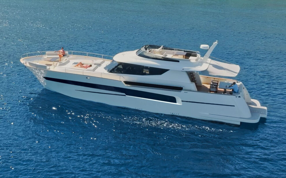 Modern white yacht cruising on open blue sea